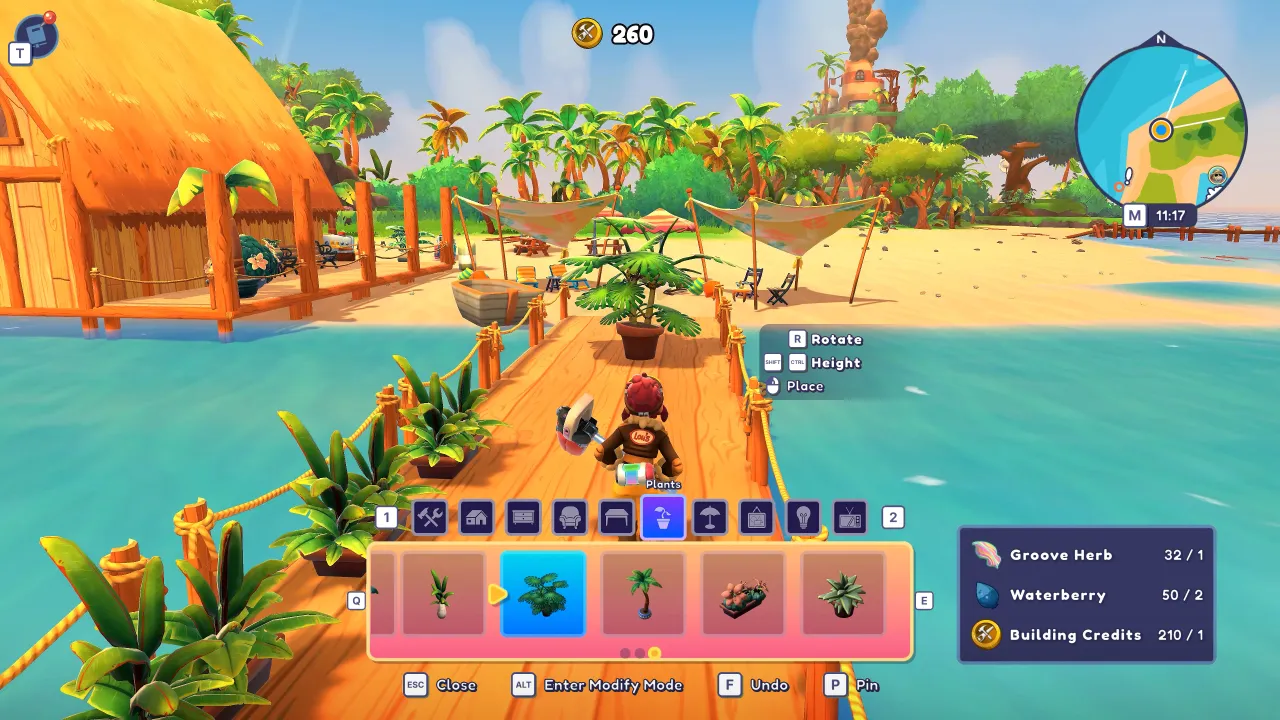 Inventory and hotbar UI over a beach town, with a resource list showing Waterberry and other materials